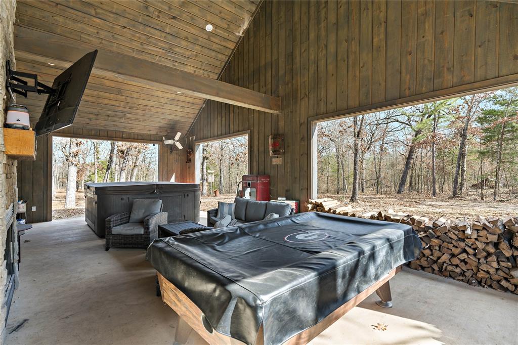 8127 Fm 910 Bogata, TX 75417 - Photo 19 of 22 a kitchen with a stove and a table