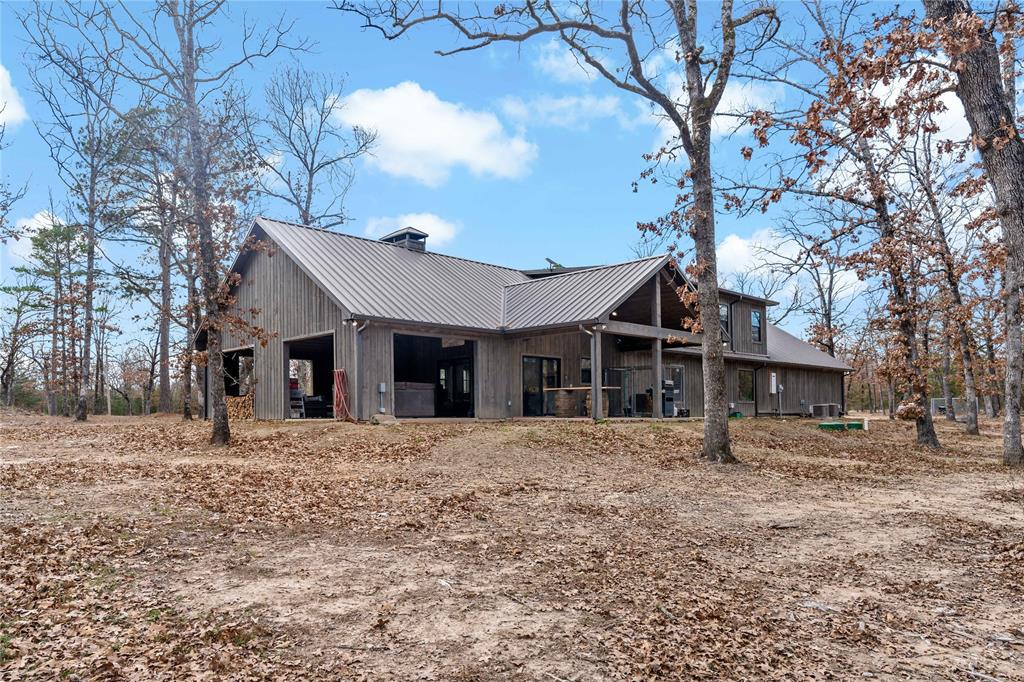 8127 Fm 910 Bogata, TX 75417 - Photo 21 of 22 a front view of a house with a yard covered in snow