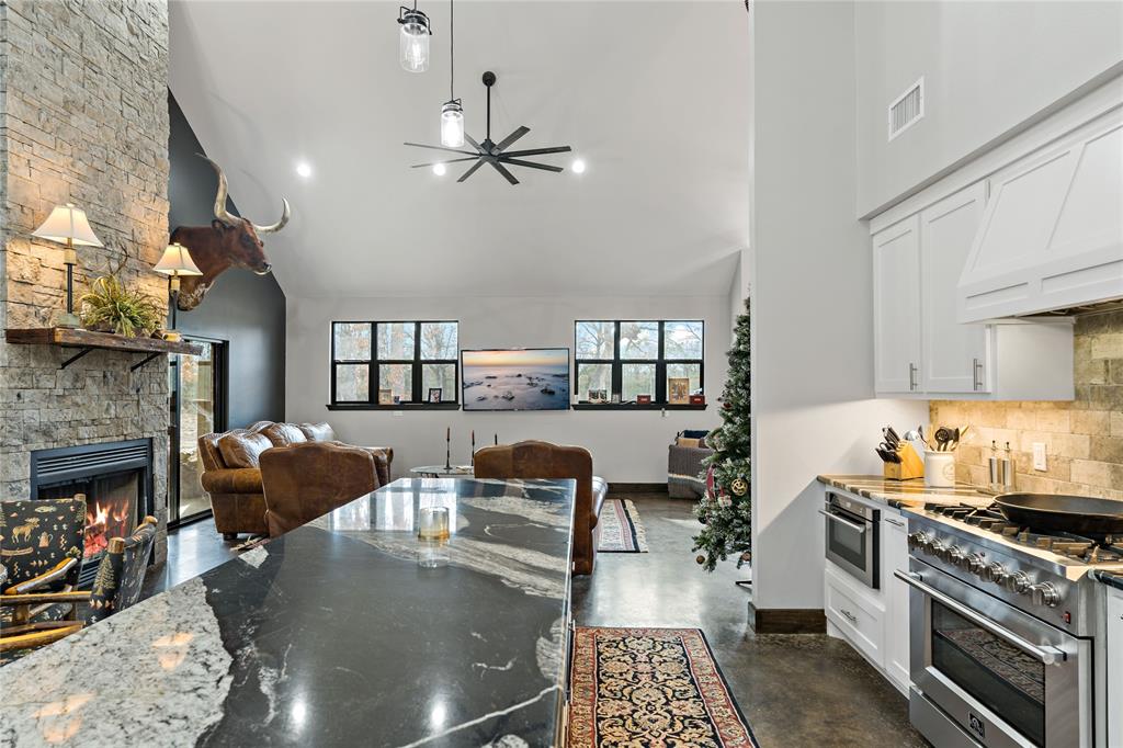 8127 Fm 910 Bogata, TX 75417 - Photo 6 of 22 a kitchen with furniture and a fireplace