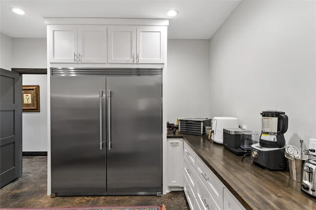 a kitchen with refrigerator and countertop