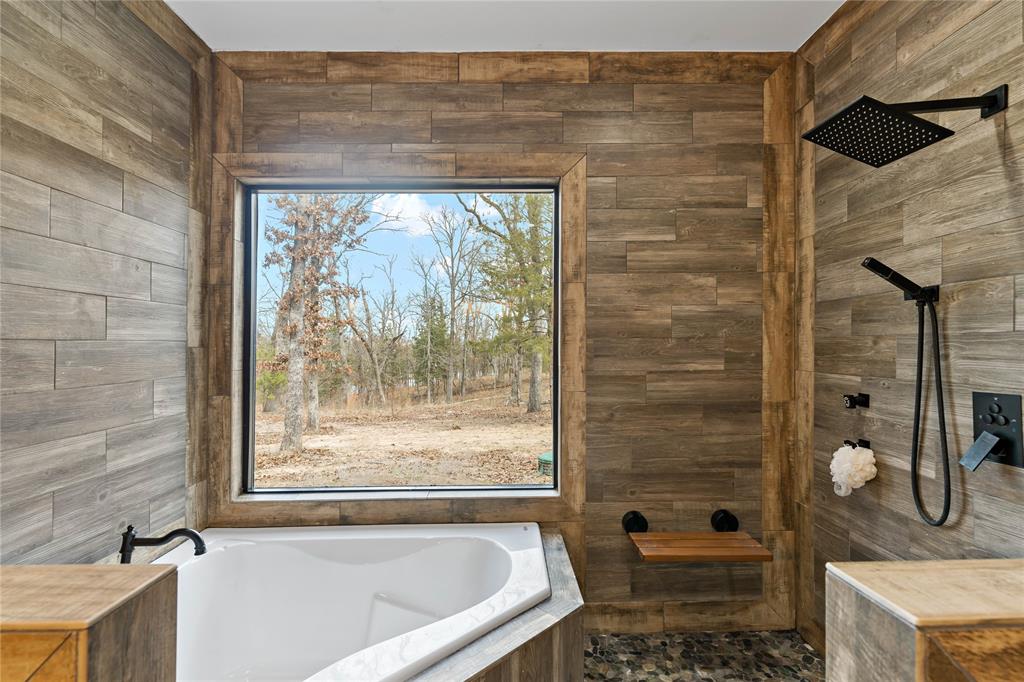8127 Fm 910 Bogata, TX 75417 - Photo 9 of 22 a bath room with a bath tub and a shower