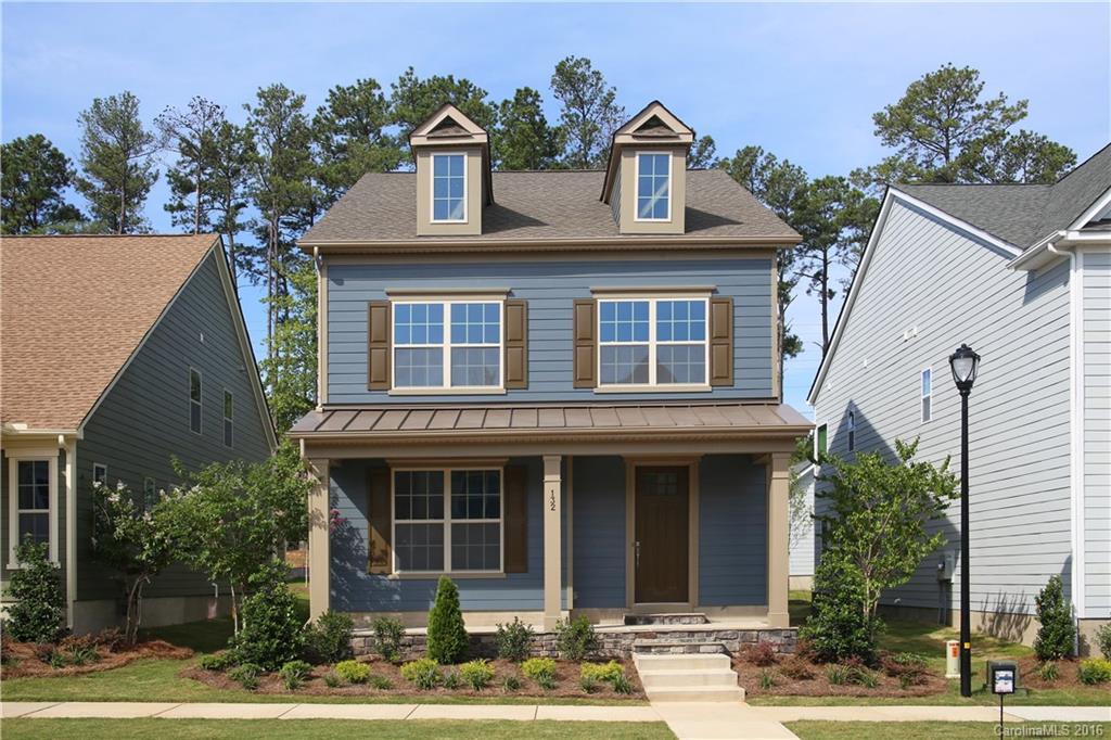 132 Helton Lane, Unit 38 Fort Mill, SC 29708 - Photo 1 of 23 a front view of a house with garden