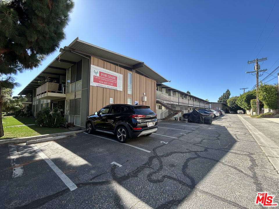 11131 Rose Avenue, Unit 13 Los Angeles, CA 90034 - Photo 12 of 17 a car parked in front of a house