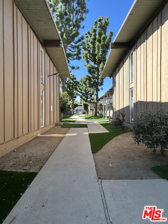 11131 Rose Avenue, Unit 13 Los Angeles, CA 90034 - Photo 14 of 17 a view of a house with a yard
