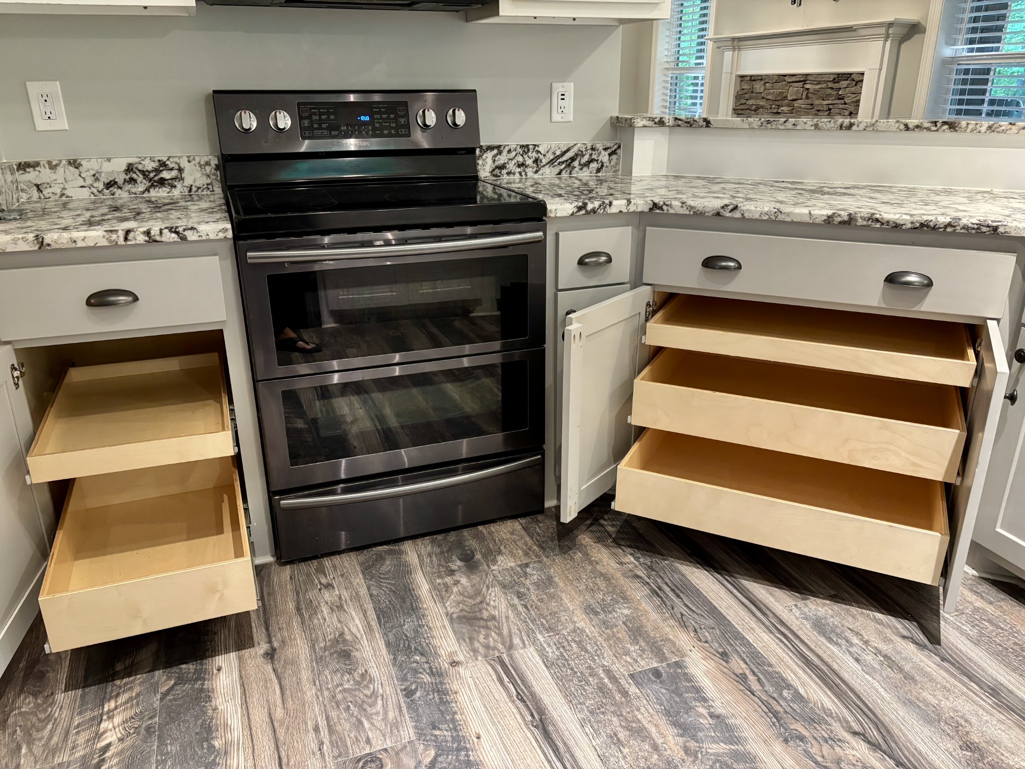 65 Sheltontown Road Manchester, TN 37355 - Photo 11 of 17 a kitchen with granite countertop a stove and a sink