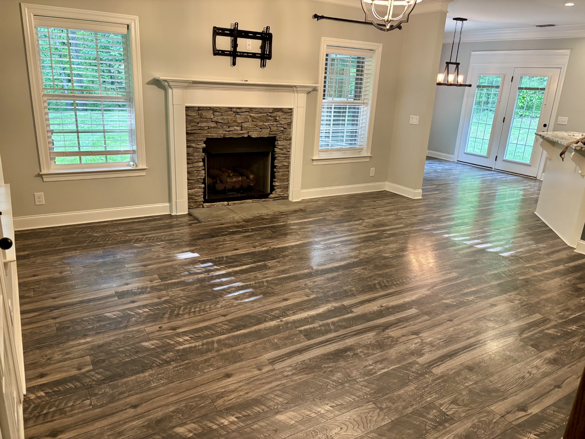 65 Sheltontown Road Manchester, TN 37355 - Photo 8 of 17 a view of an empty room with wooden floor fireplace and a window