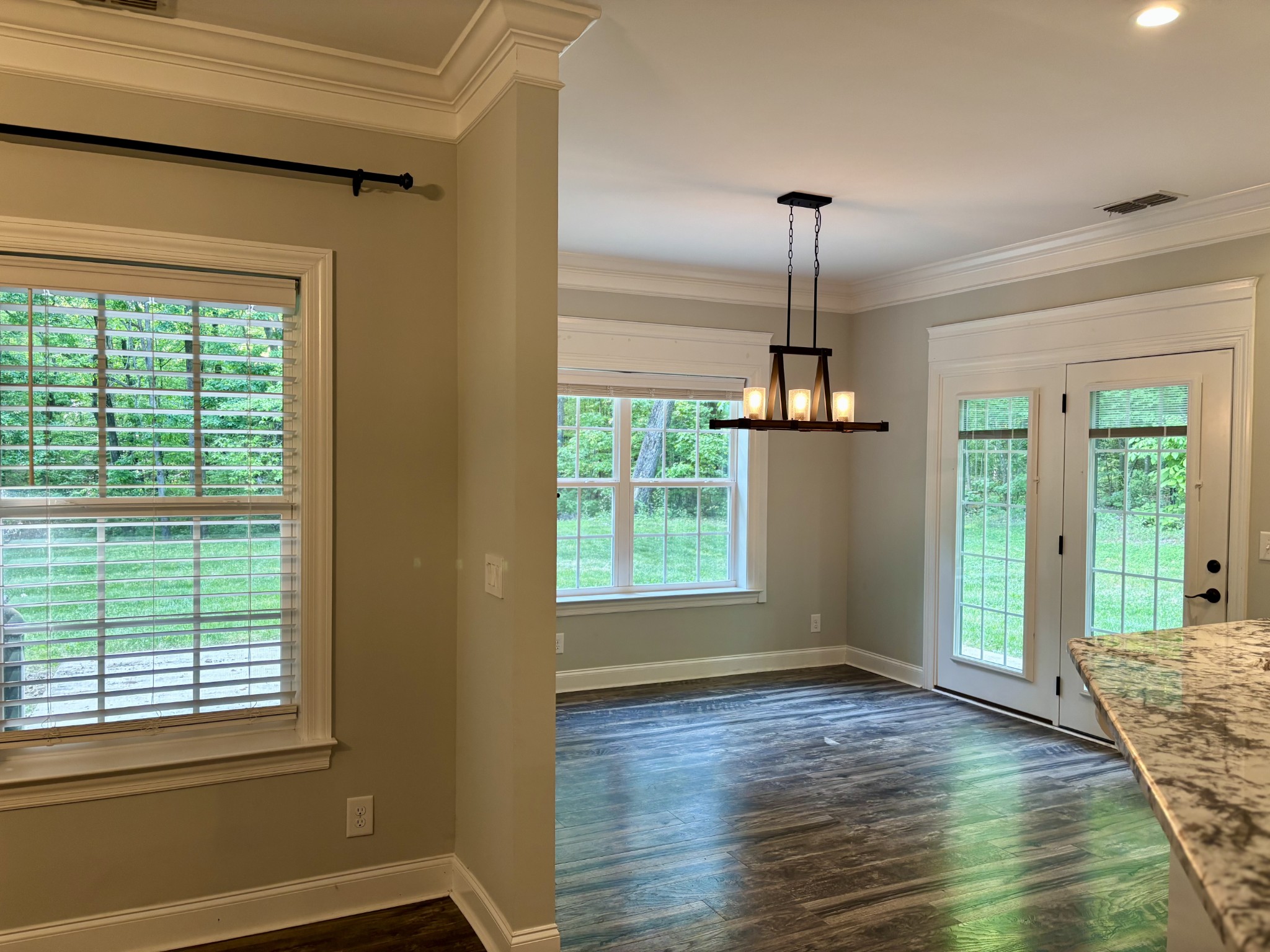 65 Sheltontown Road Manchester, TN 37355 - Photo 9 of 17 a view of a room with wooden floor ceiling fan and windows