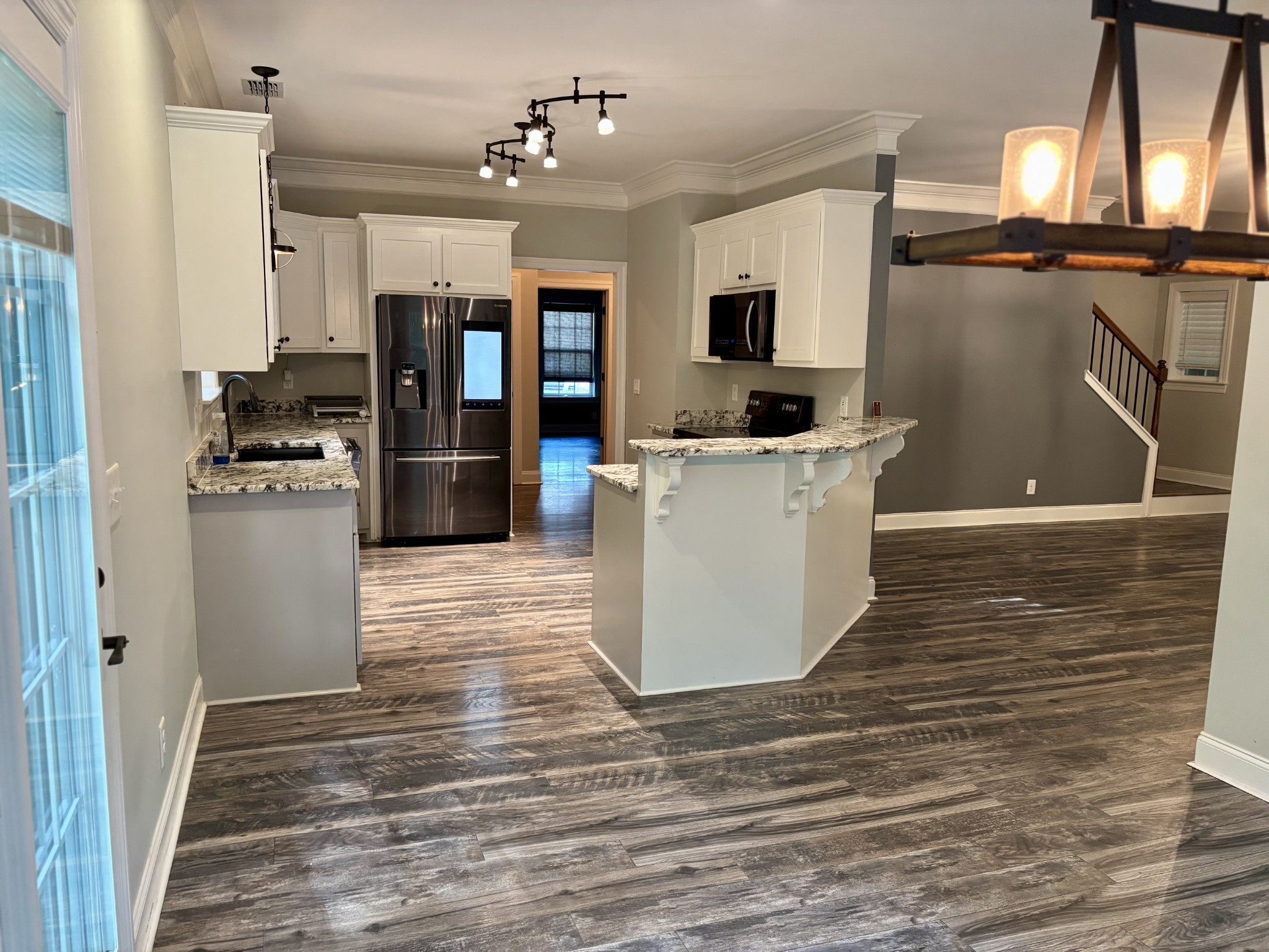 65 Sheltontown Road Manchester, TN 37355 - Photo 10 of 17 a kitchen with stainless steel appliances kitchen island granite countertop a refrigerator a stove top oven a sink and dishwasher