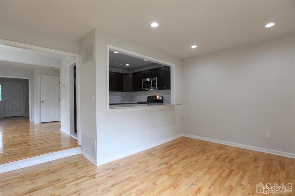 3304 Hana Road Edison, NJ 08817 - Photo 3 of 13 a view of empty room with wooden floor
