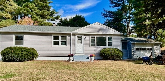 15 Garcia Street Springfield, MA 01129 - Photo 1 of 11 a front view of a house with a garden