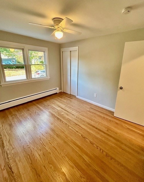 15 Garcia Street Springfield, MA 01129 - Photo 9 of 11 a view of an empty room with wooden floor and a window