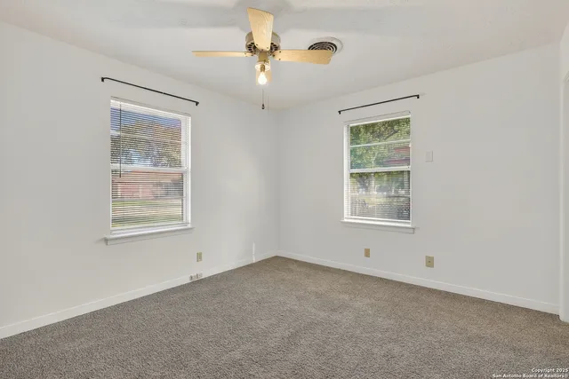 a view of an empty room with a window