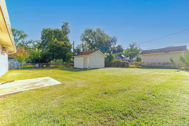 a view of a swimming pool with an outdoor space and seating area