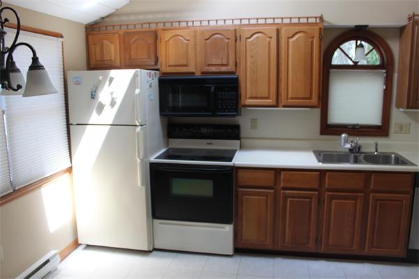 1 Island Road Holland, MA 01521 - Photo 27 of 30 a kitchen with stainless steel appliances granite countertop a refrigerator and a stove