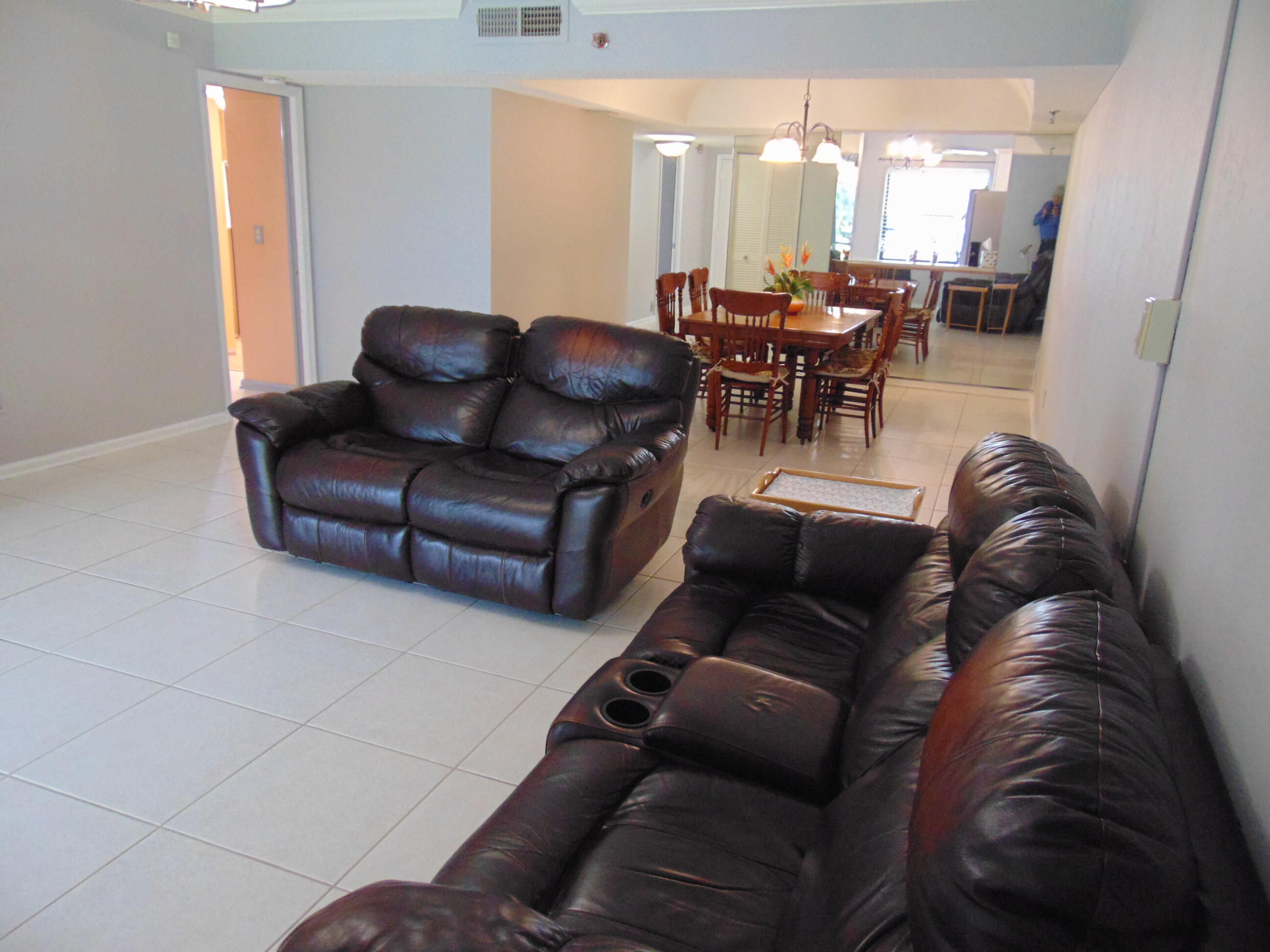 9220 Southwest 14th Street, Unit 3103 Boca Raton, FL 33428 - Photo 25 of 58 a living room with furniture and a large window