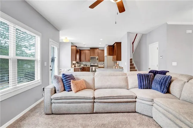 a kitchen with stainless steel appliances a sink stove and microwave