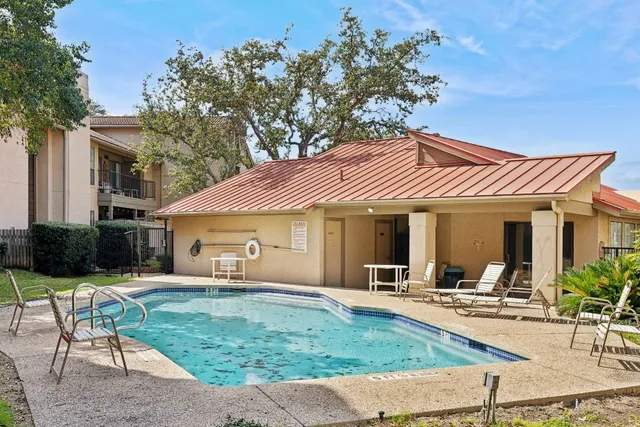a view of a pathway both side of house