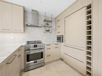 a kitchen with cabinets and white appliances