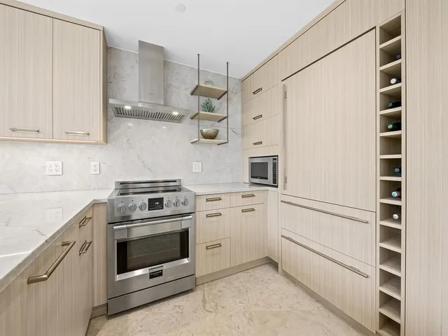 a kitchen with cabinets and white appliances