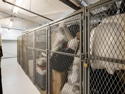 a view of walk in closet with clothes