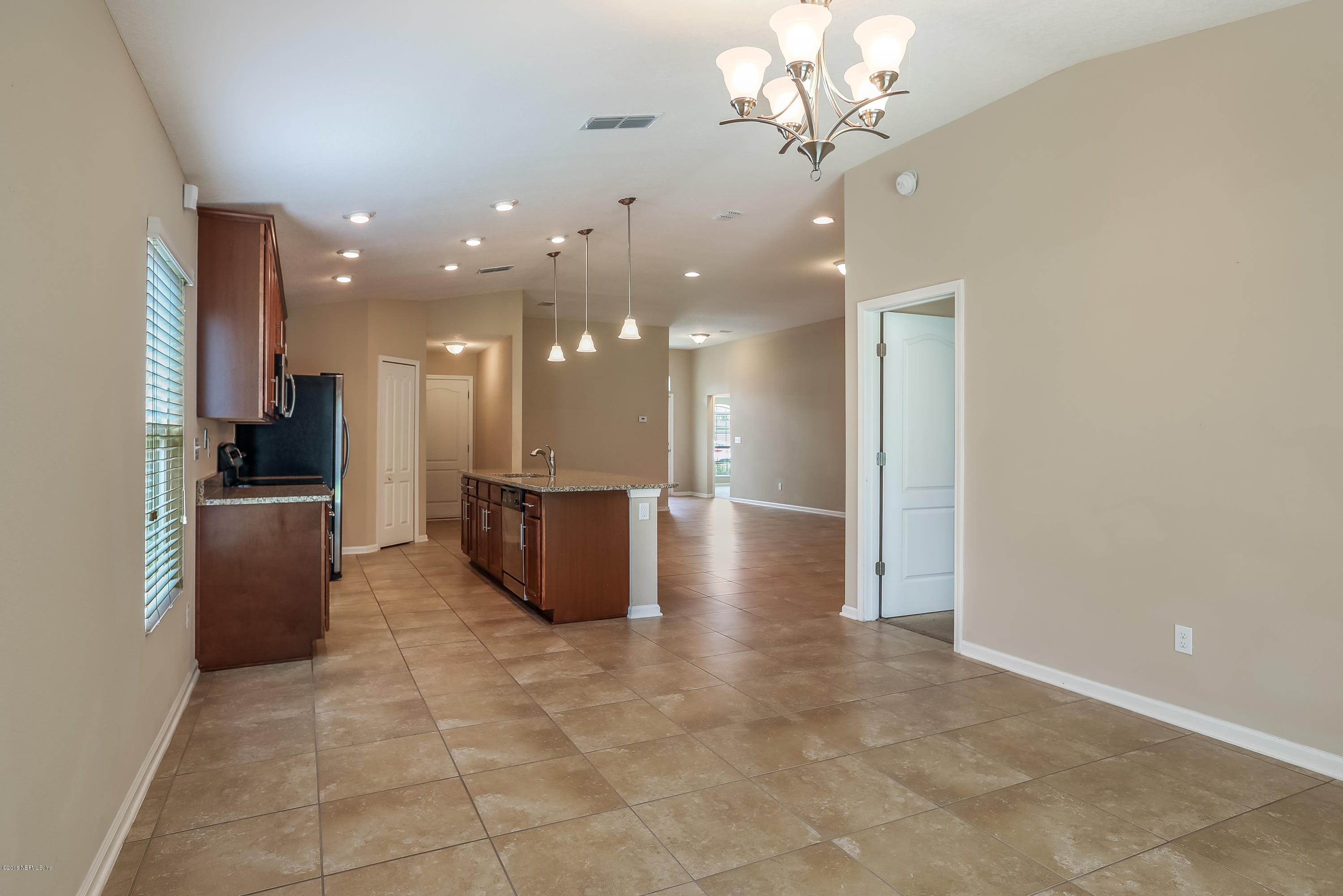 12143 Verde Gardens Road Jacksonville, FL 32218 - Photo 16 of 21 011_KitchenDining