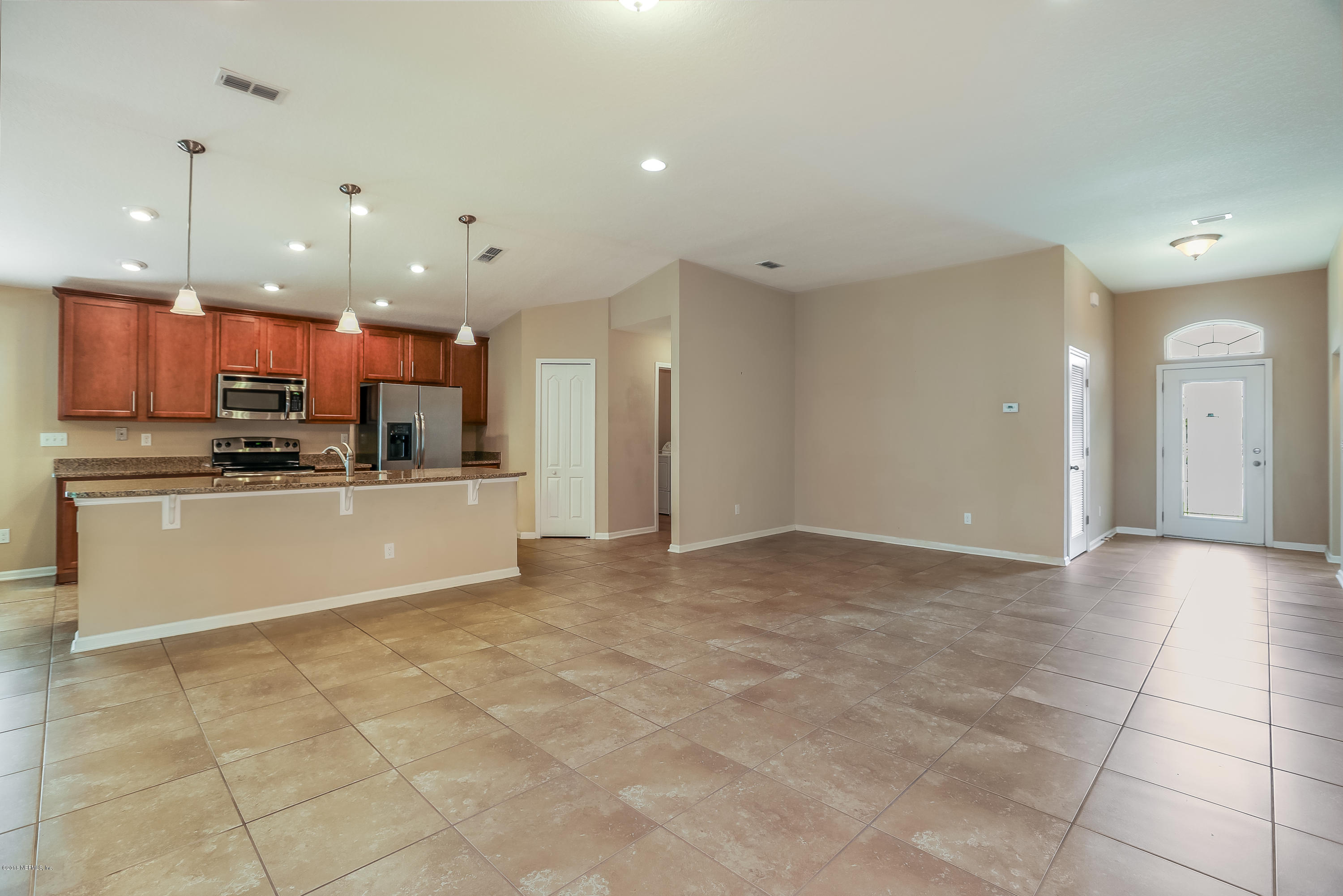 12143 Verde Gardens Road Jacksonville, FL 32218 - Photo 6 of 21 006_Family RoomKitchen