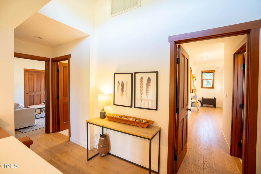 316 West Ortega Street, Unit B Santa Barbara, CA 93101 - Photo 13 of 19 a view of a hallway with wooden floor and a living room
