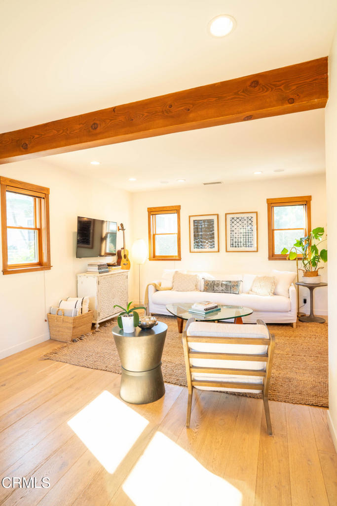 316 West Ortega Street, Unit B Santa Barbara, CA 93101 - Photo 4 of 19 a living room with furniture a flat screen tv and a table