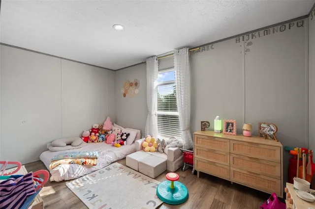 a bedroom with furniture and a bed