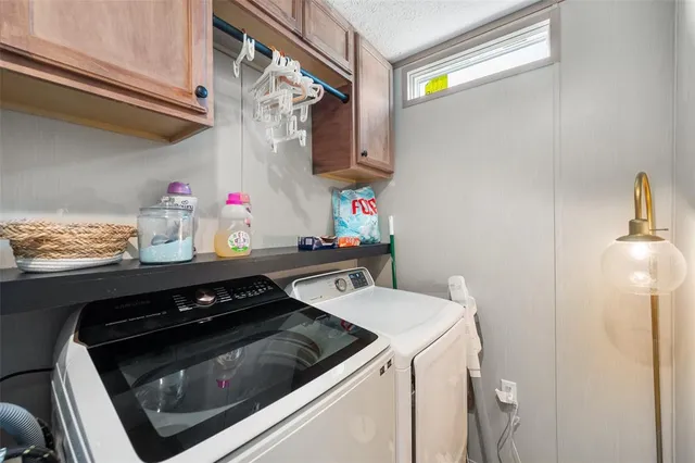 a kitchen with storage and utility