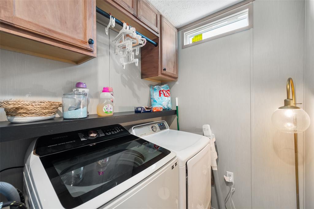 421 Garitty Street Frost, TX 76641 - Photo 22 of 25 a kitchen with storage and utility