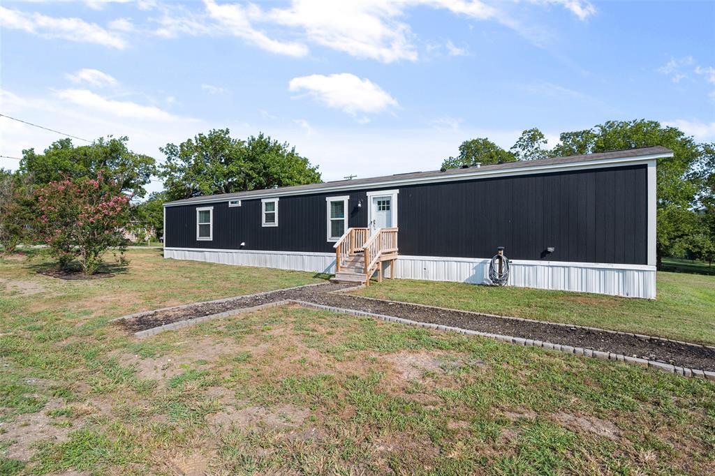 421 Garitty Street Frost, TX 76641 - Photo 4 of 25 a front view of a house with a yard