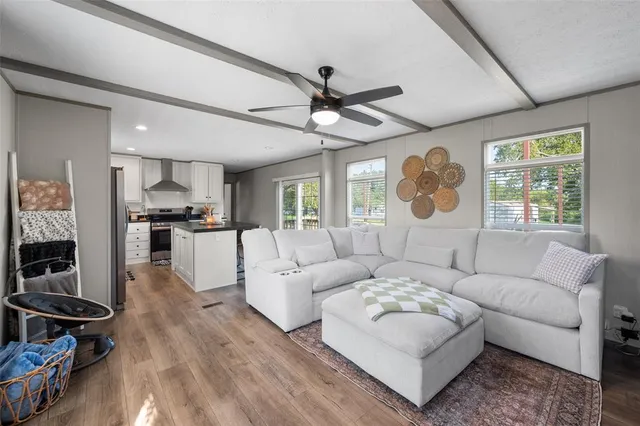 a living room with furniture and a large window