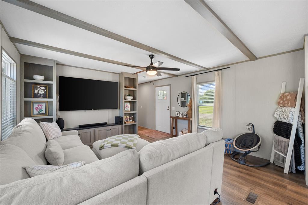 421 Garitty Street Frost, TX 76641 - Photo 7 of 25 a living room with furniture and a flat screen tv