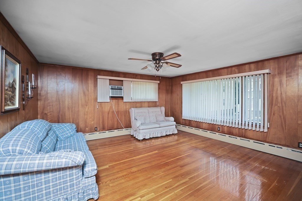 382 America Street Fall River, MA 02721 - Photo 13 of 25 a living room with a couch and a window