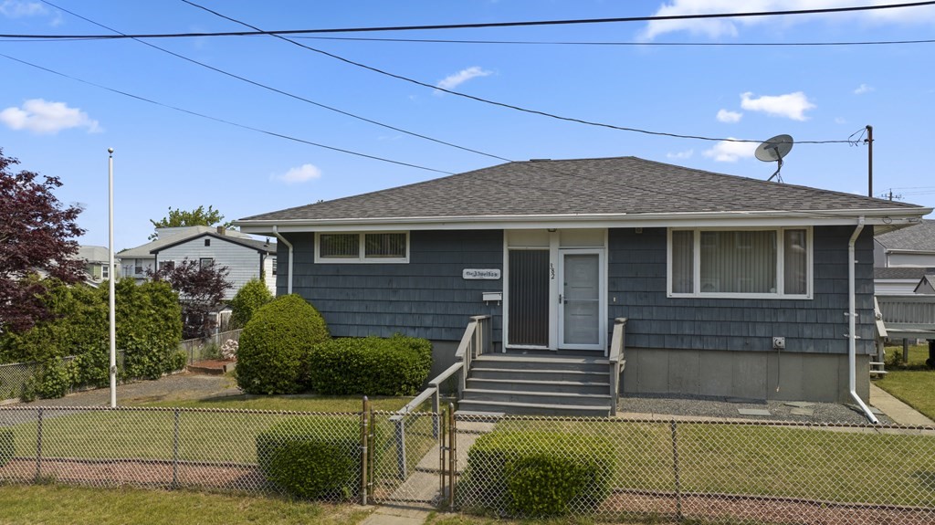 382 America Street Fall River, MA 02721 - Photo 2 of 25 a front view of a house with a garden