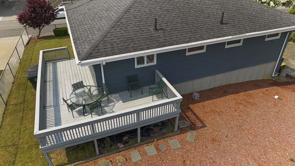 382 America Street Fall River, MA 02721 - Photo 3 of 25 a balcony with wooden floor and potted plants