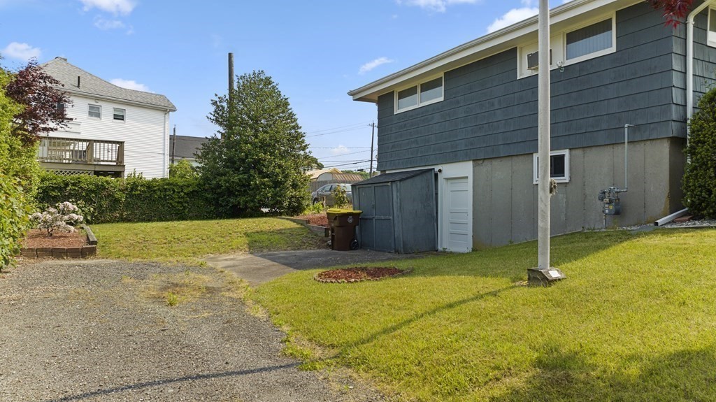 382 America Street Fall River, MA 02721 - Photo 5 of 25 a view of a house with backyard and trees