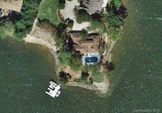 988 Cove Point Lane Tega Cay, SC 29708 - Photo 2 of 22 an aerial view of a house with yard swimming pool and outdoor seating