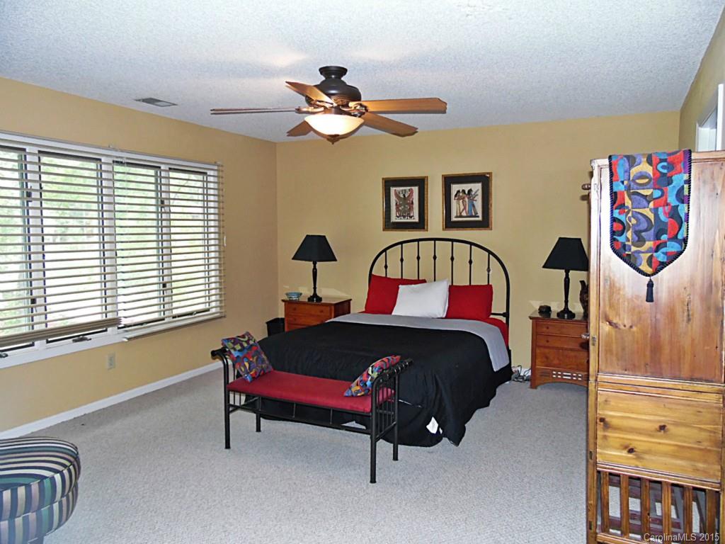 988 Cove Point Lane Tega Cay, SC 29708 - Photo 15 of 22 a bedroom with a bed and a dresser