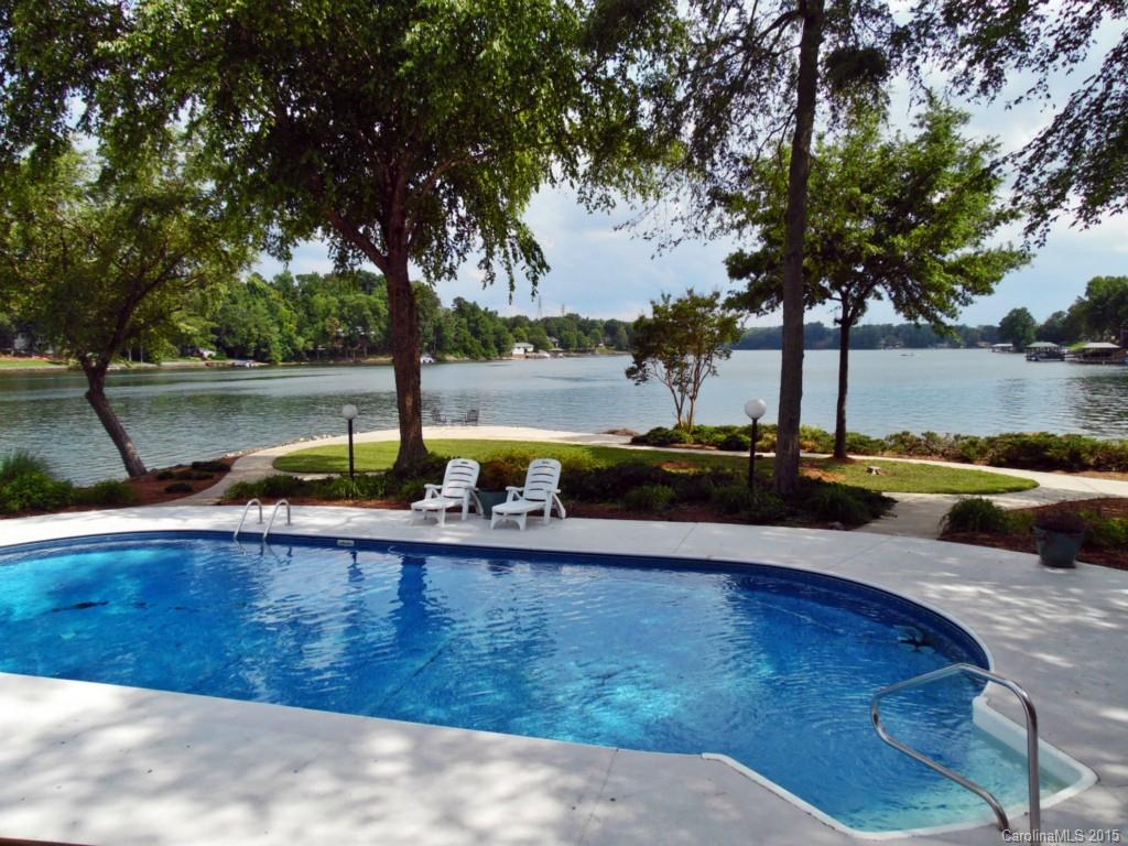 988 Cove Point Lane Tega Cay, SC 29708 - Photo 18 of 22 a view of a lake with trees