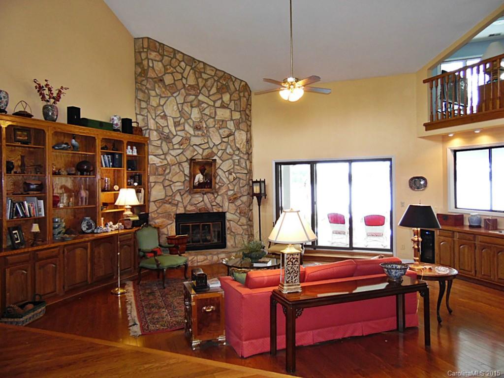 988 Cove Point Lane Tega Cay, SC 29708 - Photo 5 of 22 a living room with furniture a fireplace and a flat screen tv