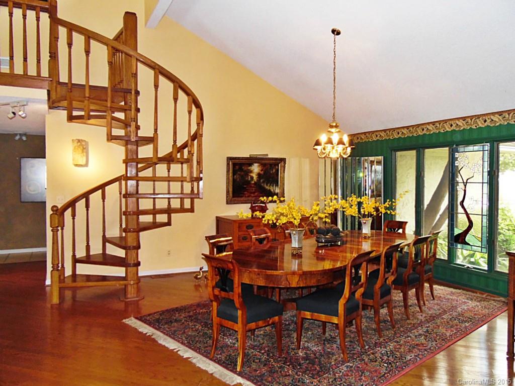 988 Cove Point Lane Tega Cay, SC 29708 - Photo 6 of 22 a view of a dining room with furniture window and wooden floor