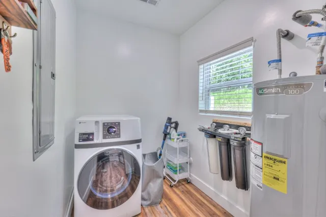 a view of a door with a washer and dryer