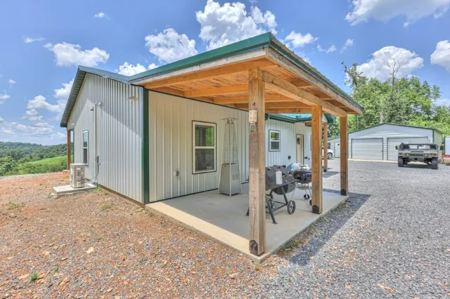 a patio with table and chairs