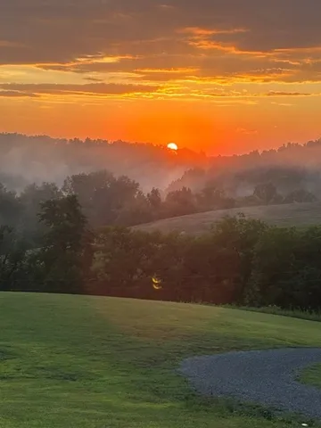 a view of an ocean and a mountain