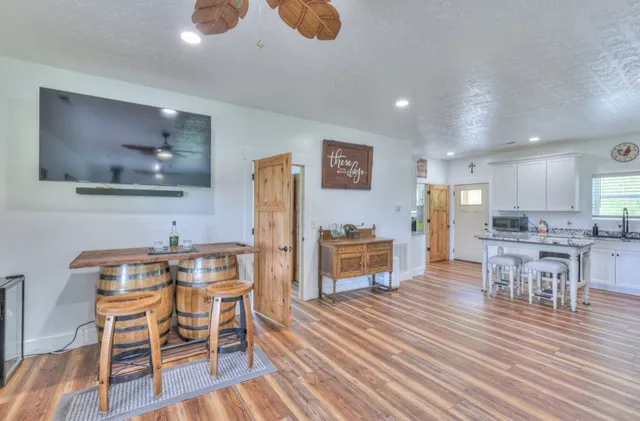 a view of a dining room with furniture and wooden floor