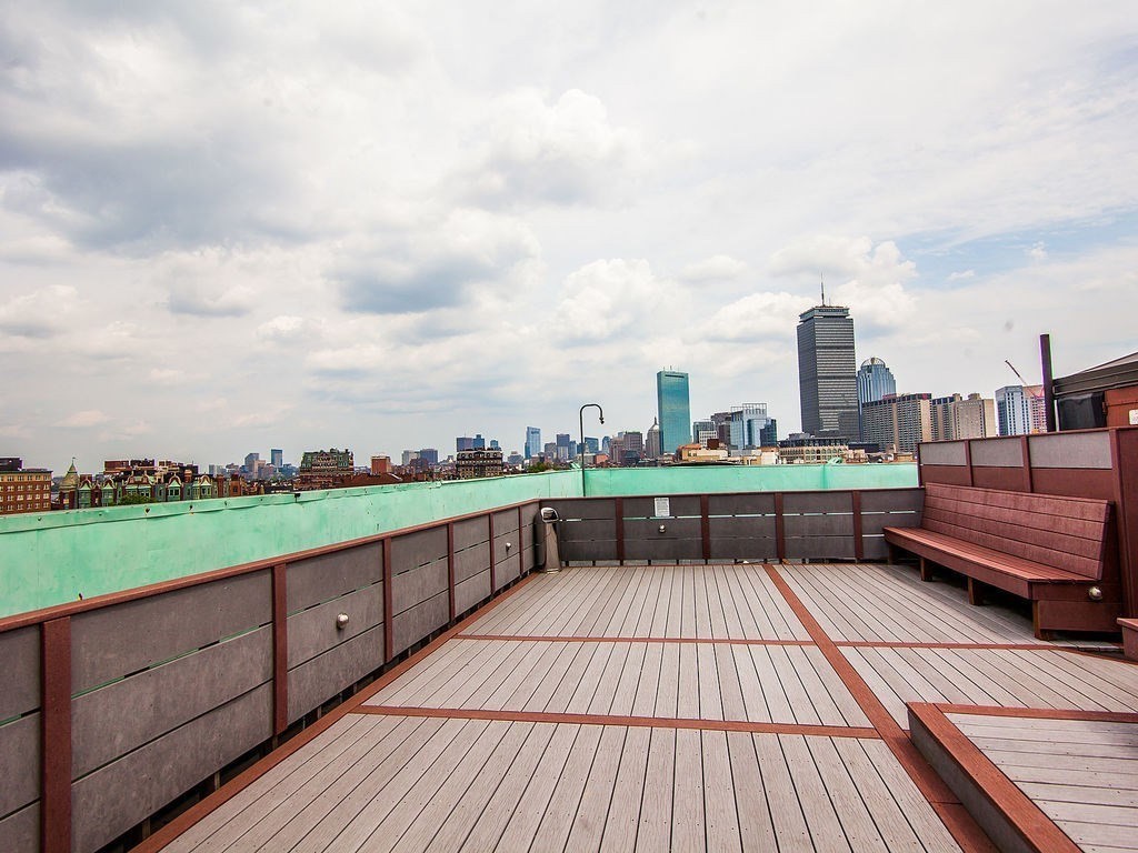 464 Commonwealth Avenue, Unit 36 Boston, MA 02215 - Photo 12 of 18 a view of a terrace with wooden benches
