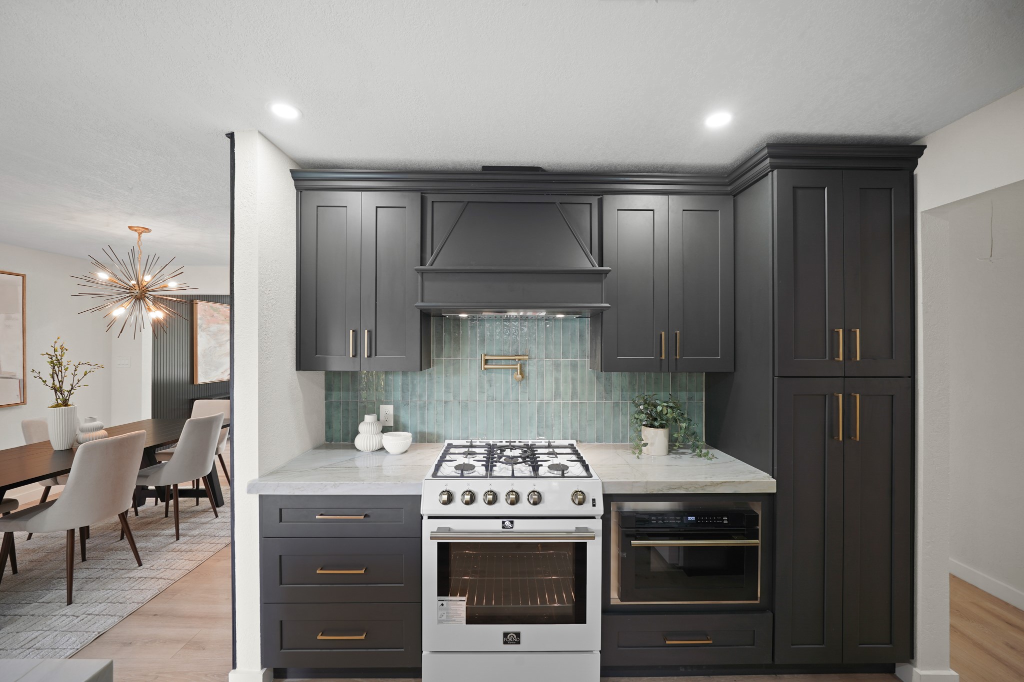 4813 Hummingbird Street Houston, TX 77035 - Photo 10 of 50 a kitchen with a stove and a refrigerator