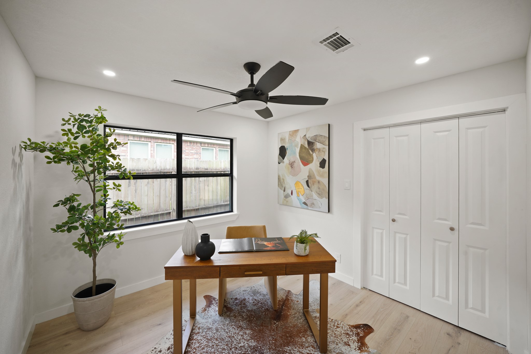 4813 Hummingbird Street Houston, TX 77035 - Photo 17 of 50 a living room with furniture potted plant and a window